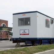 Photo of a Tri-Boro Trailer 8x24 and Storage Container in grocery store parking lot