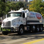 Photo of Mr. John wastewater services truck on scenic road